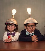 kids with light bulb hats