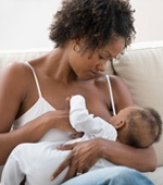 Mother and baby breastfeeding