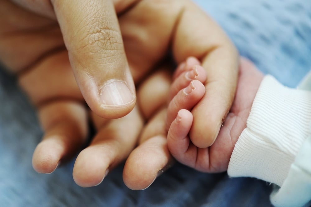 Newborn baby several days old enjoying new life